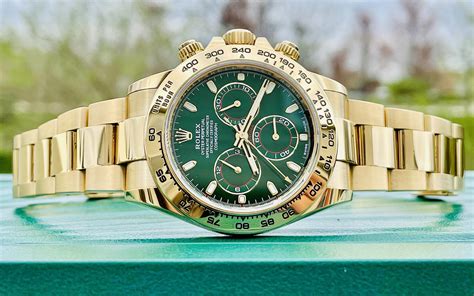 gold rolex with green dial.